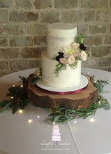 2 tier semi naked buttercream wedding cake with fresh flowers